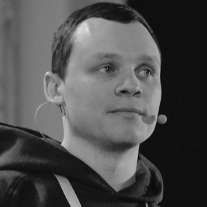 Head shot of Sergei with a microphone