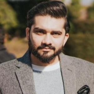 Tanveer Khan in a field
